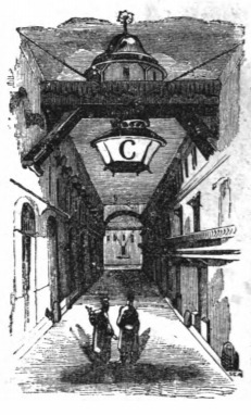 [Gulliver and his guide walk through the halls of the Grand Academy of Lagado]